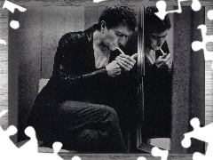 kurtka skórzana, papieros, Gary Oldman