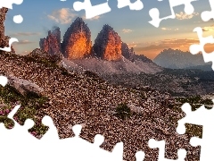 RozĹwietlone, ZachĂłd sĹoĹca, SkaĹy, GĂłry, Kwiaty, WĹochy, Tre Cime di Lavaredo, Kamienie, Dolomity